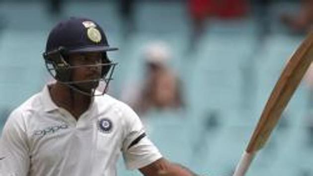 India's Mayank Agarwal raises his bat after making 50 runs against Australia during their cricket test match in Sydney, Thursday, Jan. 3, 2019.(AP)