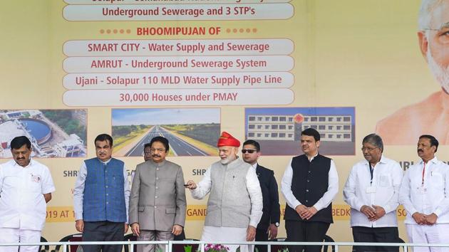 Prime Minister Narendra Modi inaugurates the Solapur-Tuljapur-Osmanabad section of New NH-52, in Solapur, Maharashtra. Modi also laid the foundation stone of an over Rs 1,800 crore project of 30,000 houses under Pradhan Mantri Awas Yojana there. (PTI)