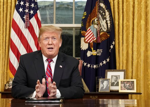 US President Donald Trump delivers a televised address to the nation from his desk in the Oval Office about immigration and the southern US border on the 18th day of a partial government shutdown at the White House in Washington, US.(REUTERS)