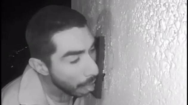 Footage that’s gone crazy viral shows the man, identified as Roberto Daniel Arroyo, 33, licking the doorbell for hours. (Screengrab) Footage that’s gone crazy viral shows the man, identified as Roberto Daniel Arroyo, 33, licking the doorbell for hours. (Screengrab)