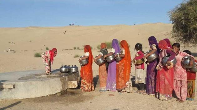 Women in Barmer villages walk between three and five kilometres every day in all seasons to fetch drinking water for their families.(HT Photo) Women in Barmer villages walk between three and five kilometres every day in all seasons to fetch drinking water for their families.(HT Photo)