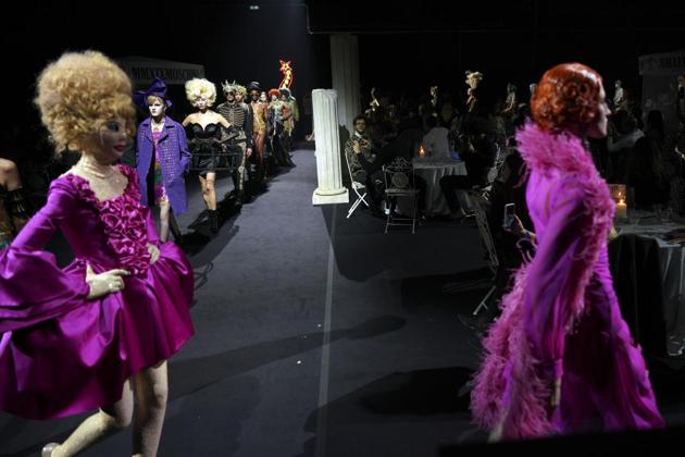 Models display creations part of the Moschino fall-winter 2019/20 men’s collection and women’s pre-collection (AP)