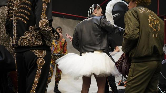 Models wait to wait to pose for photos at the end of the unveiling of the Moschino fall-winter 2019/20 men’s collection and women’s pre-collection (AP)
