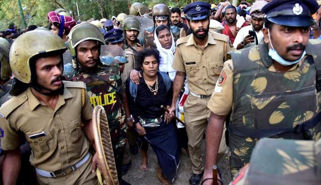 Bindu Ammini, 42, and Kanaka Durga, 44, are escorted by police after they attempted to enter the Sabarimala temple in Pathanamthitta district in Kerala on December 24.(REUTERS)