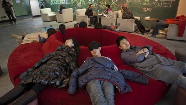 Staff members take a nap in the recreation room at the head office of Renren Inc. in Beijing, China. Photographer:Adam Dean/Bloomberg (Bloomberg/ Representative Image) Staff members take a nap in the recreation room at the head office of Renren Inc. in Beijing, China. Photographer:Adam Dean/Bloomberg (Bloomberg/ Representative Image)