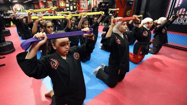 Gharib established the academy in 2014 after learning kajukenbo in the US. He said he wanted to teach the sport to women back home as a way to stay fit and to defend themselves. “We focus on self-defence skills and place the girls in conditions similar to those on the street so we can build their self-confidence and teach them exactly when and where to expect the hit,” Gharib said. (Yasser Al-Zayyat / AFP) Gharib established the academy in 2014 after learning kajukenbo in the US. He said he wanted to teach the sport to women back home as a way to stay fit and to defend themselves. “We focus on self-defence skills and place the girls in conditions similar to those on the street so we can build their self-confidence and teach them exactly when and where to expect the hit,” Gharib said. (Yasser Al-Zayyat / AFP)