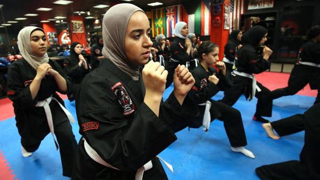 Hasnawi remembers being bullied as a child -- something her daughter struggled with at school too. But she said Riham has “changed a lot” since they started kajukenbo, gaining patience and strength through the sport. “She has transformed. At school, she used to get really angry and quickly agitated if someone would say something to her,” Hasnawi said. “Now, it’s something normal that she can (healthily) deal with.” (Yasser Al-Zayyat / AFP) Hasnawi remembers being bullied as a child -- something her daughter struggled with at school too. But she said Riham has “changed a lot” since they started kajukenbo, gaining patience and strength through the sport. “She has transformed. At school, she used to get really angry and quickly agitated if someone would say something to her,” Hasnawi said. “Now, it’s something normal that she can (healthily) deal with.” (Yasser Al-Zayyat / AFP)