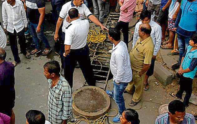 Three men died inside a manhole while cleaning it. (HT Photo) Three men died inside a manhole while cleaning it. (HT Photo)