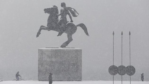 People make their way at the seaside promenade as snow covers the statue of Alexander the Great in Thessaloniki, Greece. Dozens of refugees housed in tents at a migrant camp in northern Greece protested their harsh living conditions as temperatures in some areas sunk to minus 20 degrees Celsius. (Alexandros Avramidis / REUTERS) People make their way at the seaside promenade as snow covers the statue of Alexander the Great in Thessaloniki, Greece. Dozens of refugees housed in tents at a migrant camp in northern Greece protested their harsh living conditions as temperatures in some areas sunk to minus 20 degrees Celsius. (Alexandros Avramidis / REUTERS)