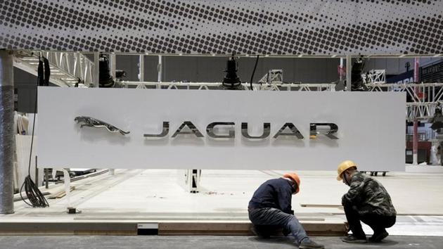 Workers set up the booth for British car manufacturer Jaguar Land Rover's Jaguar brand inside the National Exhibition and Convention Center, the venue for the upcoming China International Import Expo (CIIE), in Shanghai, China October 28. (REUTERS) Workers set up the booth for British car manufacturer Jaguar Land Rover's Jaguar brand inside the National Exhibition and Convention Center, the venue for the upcoming China International Import Expo (CIIE), in Shanghai, China October 28. (REUTERS)