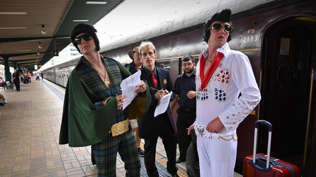 Elvis fans look for a friend at Central station before boarding a train. Street markets, lookalike contests, parades, a car show, displays of Presley artefacts and tribute performances are planned in Parkes. (Peter Parks / AFP) Elvis fans look for a friend at Central station before boarding a train. Street markets, lookalike contests, parades, a car show, displays of Presley artefacts and tribute performances are planned in Parkes. (Peter Parks / AFP)