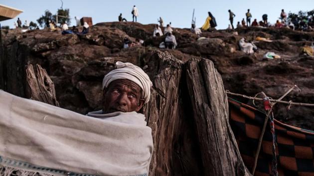 Ethiopian Orthodox pilgrims rest at one of pilgrim camp sites in Lalibela, Ethiopia. The Ethiopian Orthodox Christmas called Ledet or Genna celebrated on January 7 attracted pilgrims from all over the country. (Eduardo Soteras / AFP) Ethiopian Orthodox pilgrims rest at one of pilgrim camp sites in Lalibela, Ethiopia. The Ethiopian Orthodox Christmas called Ledet or Genna celebrated on January 7 attracted pilgrims from all over the country. (Eduardo Soteras / AFP)