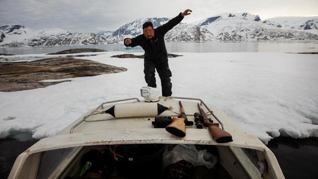 Seal hunter Henrik Josvasson jumps back onto his boat after searching for puffin eggs near Tasiilaq. Continued global warming will accelerate thawing of the ice sheet and contribute to rising sea levels, scientists have found. Nielsen said that, over the last 10 years, it has become increasingly hard to reach usual hunting grounds with sled dogs due to unpredictable weather, thinning ice or no ice at all. (Lucas Jackson / REUTERS) Seal hunter Henrik Josvasson jumps back onto his boat after searching for puffin eggs near Tasiilaq. Continued global warming will accelerate thawing of the ice sheet and contribute to rising sea levels, scientists have found. Nielsen said that, over the last 10 years, it has become increasingly hard to reach usual hunting grounds with sled dogs due to unpredictable weather, thinning ice or no ice at all. (Lucas Jackson / REUTERS)