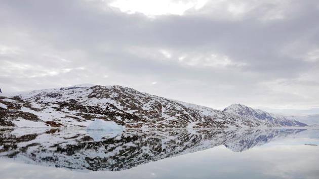 The snow-covered shore is reflected in the still water of a fjord near Tasiilaq. Despite the new challenges brought by the changing climate, Greenland’s residents are known for their resilience. “The beauty is that Greenlanders have always been good at adapting, so they will survive anyway, whatever will happen,” Moeller said. (Lucas Jackson / REUTERS) The snow-covered shore is reflected in the still water of a fjord near Tasiilaq. Despite the new challenges brought by the changing climate, Greenland’s residents are known for their resilience. “The beauty is that Greenlanders have always been good at adapting, so they will survive anyway, whatever will happen,” Moeller said. (Lucas Jackson / REUTERS)