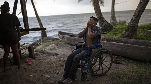 28-year-old lobster diver Charles "Charly" Melendez puts his hands over his face in frustration as he comes to terms with having to rely on a wheelchair to get around, in Puerto Lempira. For a man who always made his living diving, it's a nightmare being confined to a wheelchair. "I still can't stand up by myself," he said. "I can't sit for a long time; after an hour my body hurts. (Rodrigo Abd / AP) 28-year-old lobster diver Charles "Charly" Melendez puts his hands over his face in frustration as he comes to terms with having to rely on a wheelchair to get around, in Puerto Lempira. For a man who always made his living diving, it's a nightmare being confined to a wheelchair. "I still can't stand up by myself," he said. "I can't sit for a long time; after an hour my body hurts. (Rodrigo Abd / AP)