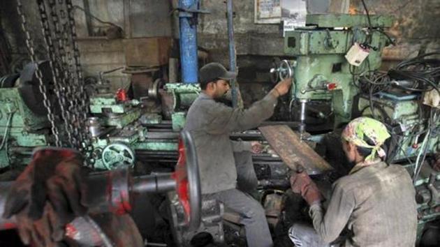 Workers make gear parts for cranes inside a workshop in Mumbai. (Reuters) Workers make gear parts for cranes inside a workshop in Mumbai. (Reuters)