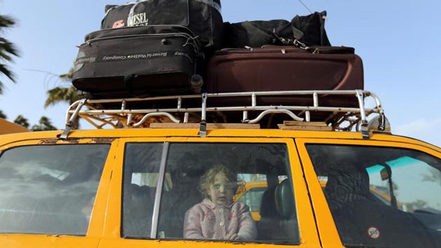 A Palestinian girl looks out of a car upon her return with her family to Gaza, at Rafah border crossing in the southern Gaza Strip. (Ibraheem Abu Mustafa / REUTERS) A Palestinian girl looks out of a car upon her return with her family to Gaza, at Rafah border crossing in the southern Gaza Strip. (Ibraheem Abu Mustafa / REUTERS)