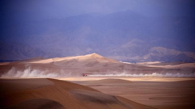 Dutch driver Maurik Van Den Heuvel, co-driver Peter Kuijpers and Martijn Van Rooij compete during Stage 1 of the Dakar 2019 between Lima and Pisco, Peru. Toyota’s driver Nasser Al-Attiyah of Qatar and his co-driver Mathieu Baumel of France won the stage. (Franck Fife / AFP) Dutch driver Maurik Van Den Heuvel, co-driver Peter Kuijpers and Martijn Van Rooij compete during Stage 1 of the Dakar 2019 between Lima and Pisco, Peru. Toyota’s driver Nasser Al-Attiyah of Qatar and his co-driver Mathieu Baumel of France won the stage. (Franck Fife / AFP)