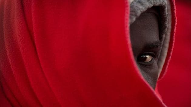 A migrant keeps warm with a Red Cross blanket upon arrival at the harbour of Malaga, after an inflatable boat carrying 185 migrants was rescued by the Spanish coast guard, off the Spanish coast. (Jorge Guerrero / AFP) A migrant keeps warm with a Red Cross blanket upon arrival at the harbour of Malaga, after an inflatable boat carrying 185 migrants was rescued by the Spanish coast guard, off the Spanish coast. (Jorge Guerrero / AFP)