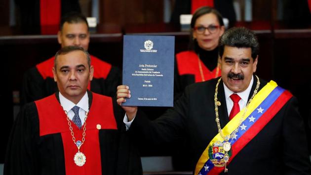 Venezuela’s President Nicolas Maduro is sworn in by Venezuela’s Supreme Court President Maikel Moreno, during the ceremonial swearing-in for his second presidential term, at the Supreme Court in Caracas, Venezuela. (Carlos Garcia Rawlins / REUTERS) Venezuela’s President Nicolas Maduro is sworn in by Venezuela’s Supreme Court President Maikel Moreno, during the ceremonial swearing-in for his second presidential term, at the Supreme Court in Caracas, Venezuela. (Carlos Garcia Rawlins / REUTERS)