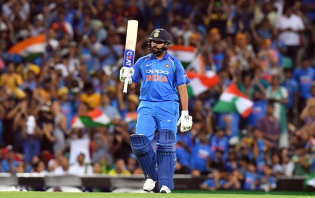 India's batsman Rohit Sharma celebrates scoring 100 runs to reach a century during the first one-day international (ODI) match between Australia and India at the Sydney Cricket Ground. (AFP)