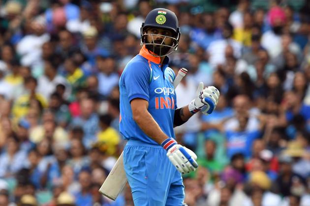India's captain Virhat Kohli walks back to the pavilion after his dismissal during the first one-day international (ODI) match between Australia and India at the Sydney Cricket Ground. (AFP)