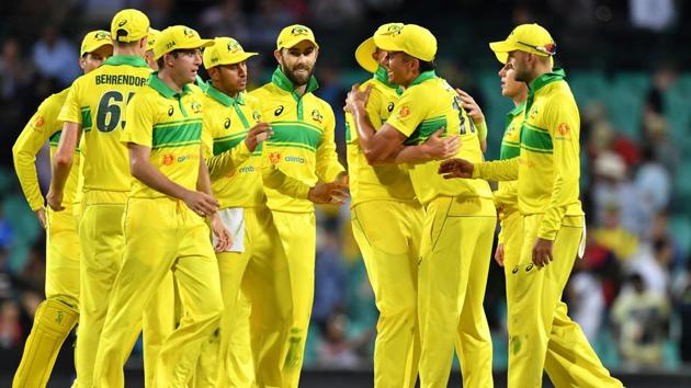 Australia's players celebrate their victory over India in the first one-day international (ODI) match at the Sydney Cricket Ground. (AFP)