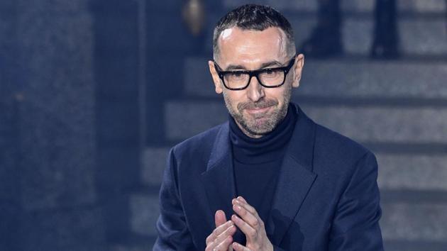 Italian fashion designer Alessandro Sartori acknowledges applause following the presentation of the the Men's Fall/Winter 2019/20 fashion collection he designed for fashion house Ermenegildo Zegna, on January 11, 2019 in Milan. (Photo by Andreas SOLARO / AFP) (AFP)