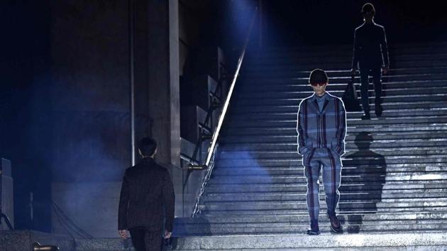 Models present creations for fashion house Ermenegildo Zegna during the Men's Fall/Winter 2019/20 fashion shows in Milan's central railway station, on January 11, 2019. (Photo by Andreas SOLARO / AFP) (AFP)