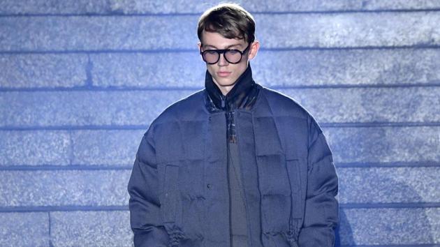 A model presents a creation for fashion house Ermenegildo Zegna during the Men's Fall/Winter 2019/20 fashion shows in Milan's central railway station, on January 11, 2019. (Photo by Andreas SOLARO / AFP) (AFP)
