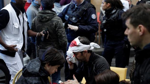 An injured man is treated after the explosion of a bakery on the corner of the streets Saint-Cecile and Rue de Trevise in central Paris on January 12, 2019. (AFP) An injured man is treated after the explosion of a bakery on the corner of the streets Saint-Cecile and Rue de Trevise in central Paris on January 12, 2019. (AFP)
