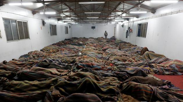Homeless men sleep inside a government-run night shelter on a cold winter night in the old quarters of Delhi. (Anushree Fadnavis / REUTERS) Homeless men sleep inside a government-run night shelter on a cold winter night in the old quarters of Delhi. (Anushree Fadnavis / REUTERS)