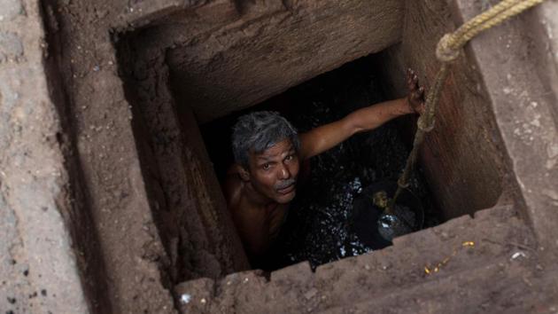 A man looks up from an underground sewage as he removes dirt in Mathura, Uttar Pradesh. (Xavier Galiana / AFP) A man looks up from an underground sewage as he removes dirt in Mathura, Uttar Pradesh. (Xavier Galiana / AFP)