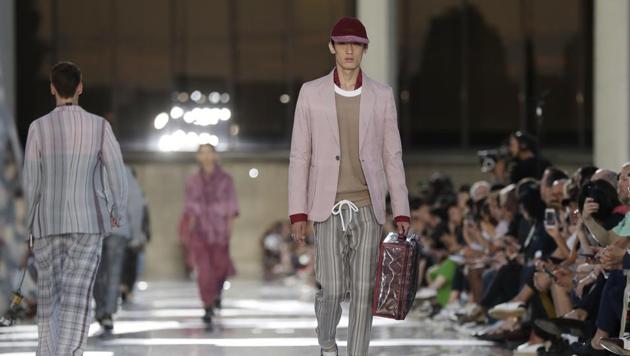 FILE- In this Friday, June 15, 2018 file photo, a model wears a creation part of the Ermenegildo Zegna men's Spring-Summer 2019 collection, that was presented in Milan, Italy. Italian fashion houses are refashioning themselves for future growth to stay on trend. The Milan Fashion Week devoted to menswear for next fall and winter opens on Friday, Jan. 11, 2019 with Ermenegildo Zegna, which made its first move to expand abroad with the Zegna Group’s summer acquisition of American brand Thom Browne. (AP Photo/Luca Bruno, File)(AP)