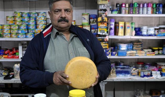 Anil Prakash at Prakash & Co, which was set up by his grandfather. In addition to their jams and jellies, they have cough drops, lozenges and even brollies. As the author and local resident Ruskin Bond once said, ‘If you want something and Prakash’s doesn’t have it, you probably don’t need it!’(HT Photo: Vinay Santosh Kumar)