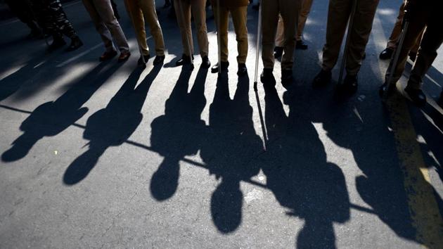 Shadow of security person seen during the protest by the Central Trade Unions on the second day of the two-day nationwide strike, at Parliament street in New Delhi. (Amal KS / HT Photo) Shadow of security person seen during the protest by the Central Trade Unions on the second day of the two-day nationwide strike, at Parliament street in New Delhi. (Amal KS / HT Photo)