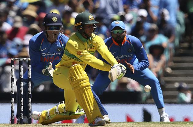 Australia's Usman Khawaja, center, plays a reverse sweep against India during their one day international cricket match in Sydney. (AP)