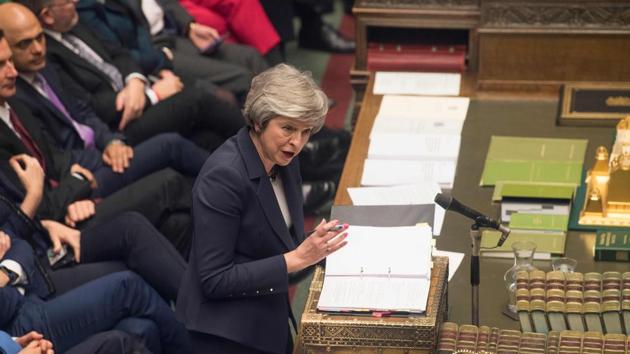 A handout photograph released by the UK Parliament shows Britain's Prime Minister Theresa May attending the weekly Prime Minister's Questions (PMQs) in the House of Commons in London in January (File Photo)(AFP)