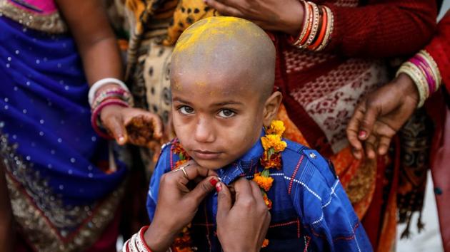 With a view to tracing the children lost during the massive Kumbh congregation here, the Uttar Pradesh police will be using RFID (radio-frequency identification) tags for kids under 14 years. (REUTERS) With a view to tracing the children lost during the massive Kumbh congregation here, the Uttar Pradesh police will be using RFID (radio-frequency identification) tags for kids under 14 years. (REUTERS)