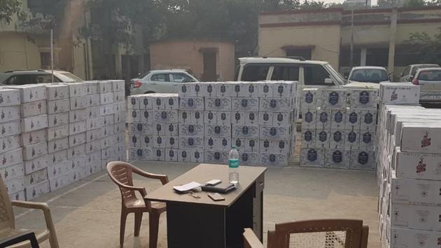 Police seized 350 cartons of whiskey from a truck near Mahamaya Flyover in the early hours of Sunday. (HT Photo) Police seized 350 cartons of whiskey from a truck near Mahamaya Flyover in the early hours of Sunday. (HT Photo)