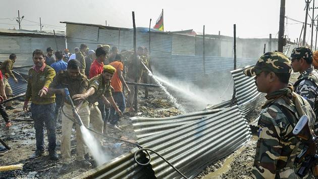 Firefighters douse a fire that broke after a cylinder exploded in a tent at the Digambar Ani Akhara at the Kumbh Mela site, in Prayagraj. According to reports, the fire started in one of the tents at Digambar Akhara and quickly spread. Police and fire fighters are at the spot to carrying out rescue operations. (PTI) Firefighters douse a fire that broke after a cylinder exploded in a tent at the Digambar Ani Akhara at the Kumbh Mela site, in Prayagraj. According to reports, the fire started in one of the tents at Digambar Akhara and quickly spread. Police and fire fighters are at the spot to carrying out rescue operations. (PTI)