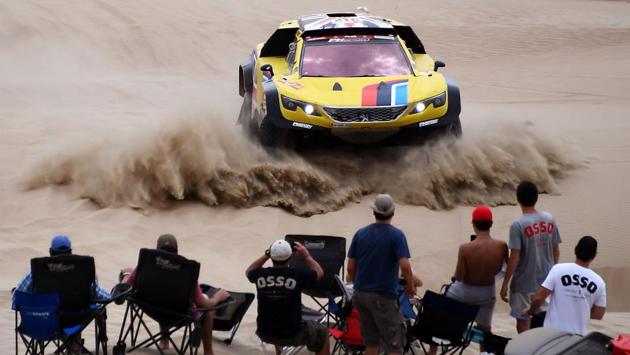Peugeot’s British driver Harry Hunt and Dutch co-driver Wouter Rosegarr compete during Stage 1 of the Dakar 2019 between Lima and Pisco. Toyota’s driver Nasser Al-Attiyah of Qatar and his co-driver Mathieu Baumel of France won the stage. (Franck Fife / AFP) Peugeot’s British driver Harry Hunt and Dutch co-driver Wouter Rosegarr compete during Stage 1 of the Dakar 2019 between Lima and Pisco. Toyota’s driver Nasser Al-Attiyah of Qatar and his co-driver Mathieu Baumel of France won the stage. (Franck Fife / AFP)