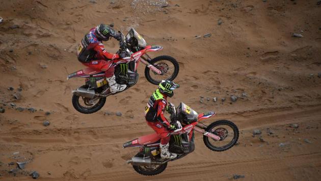 US biker Ricky Brabec and Argentina’s Kevin Benavides power their Hondas during Stage 5. Seasoned rider Aravind KP was the lone Indian to survive one of the toughest stages of the rally even as all his Sherco TVS Rally Factory teammates successfully completed the marathon Stage 5 stretching from Moquegua to Arequipa. (Franck Fife / AFP) US biker Ricky Brabec and Argentina’s Kevin Benavides power their Hondas during Stage 5. Seasoned rider Aravind KP was the lone Indian to survive one of the toughest stages of the rally even as all his Sherco TVS Rally Factory teammates successfully completed the marathon Stage 5 stretching from Moquegua to Arequipa. (Franck Fife / AFP)