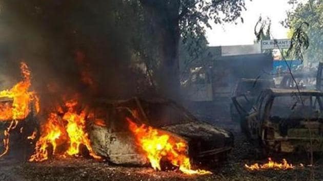 Vehicles set on fire by a mob during a protest over the alleged illegal slaughter of cattle, in Bulandshahr on December 3, 2018.(PTI Photo) Vehicles set on fire by a mob during a protest over the alleged illegal slaughter of cattle, in Bulandshahr on December 3, 2018.(PTI Photo)