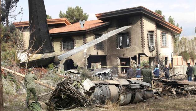 Wreckage is seen of a Boeing 707 military cargo plane which crashed on the west of the Iranian capital, near Fath airport, near Karaj, Iran on January 14. (REUTERS) Wreckage is seen of a Boeing 707 military cargo plane which crashed on the west of the Iranian capital, near Fath airport, near Karaj, Iran on January 14. (REUTERS)
