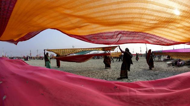 Devotees dry their clothes after taking spiritual-cleansing dips in the Sangam. Heavy security arrangements with police and paramilitary forces are in place at strategic places in Kumbh Mela grounds and other places in the city. Senior superintendent of police (SSP) Kumbh KP Singh said over 20,000 police, paramilitary and other personnel have been deployed. (Rajesh Kumar Singh / AP) Devotees dry their clothes after taking spiritual-cleansing dips in the Sangam. Heavy security arrangements with police and paramilitary forces are in place at strategic places in Kumbh Mela grounds and other places in the city. Senior superintendent of police (SSP) Kumbh KP Singh said over 20,000 police, paramilitary and other personnel have been deployed. (Rajesh Kumar Singh / AP)