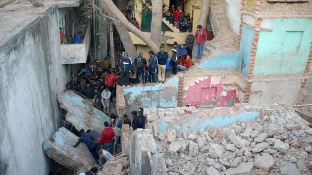 Locals said the building was being demolished to make way for a new one and the incident occurred when a part of the second storey collapsed and fell on the canopy of the first floor. (HT Photo) Locals said the building was being demolished to make way for a new one and the incident occurred when a part of the second storey collapsed and fell on the canopy of the first floor. (HT Photo)
