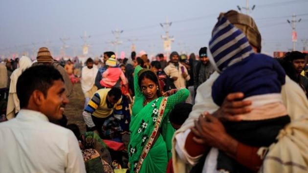 A devotee gets ready after taking a holy dip at Sangam. The production of any Kumbh is a gargantuan task, particularly in the low-lying parade grounds in Prayagraj where the ritual baths take place. Regular summertime floods leave organizers only 40 to 50 days to erect the temporary city, according to city commissioner Ashish Goel. (Danish Siddiqui / REUTERS) A devotee gets ready after taking a holy dip at Sangam. The production of any Kumbh is a gargantuan task, particularly in the low-lying parade grounds in Prayagraj where the ritual baths take place. Regular summertime floods leave organizers only 40 to 50 days to erect the temporary city, according to city commissioner Ashish Goel. (Danish Siddiqui / REUTERS)