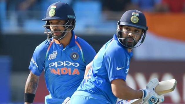 Indian cricket team captain Rohit Sharma (R) and Shikhar Dhawan runs between the wickets during the one day international (ODI) Asia Cup cricket match between Hong Kong and Indian at the Dubai International Cricket Stadium in Dubai on September 18, 2018.(AFP)