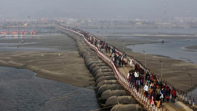 Devotees leave after taking a holy dip on Monday. Pontoon bridges have been constructed to lead the visitors to the five-kilometre bathing ghat at Sangam. Personnel have been deployed at all entry and exit points of these bridges to maintain order. (Anushree Fadnavis / REUTERS) Devotees leave after taking a holy dip on Monday. Pontoon bridges have been constructed to lead the visitors to the five-kilometre bathing ghat at Sangam. Personnel have been deployed at all entry and exit points of these bridges to maintain order. (Anushree Fadnavis / REUTERS)